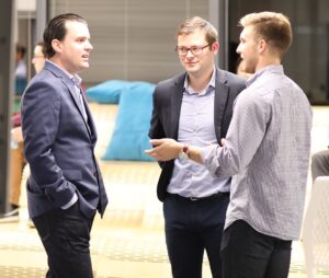 3 men at meeting